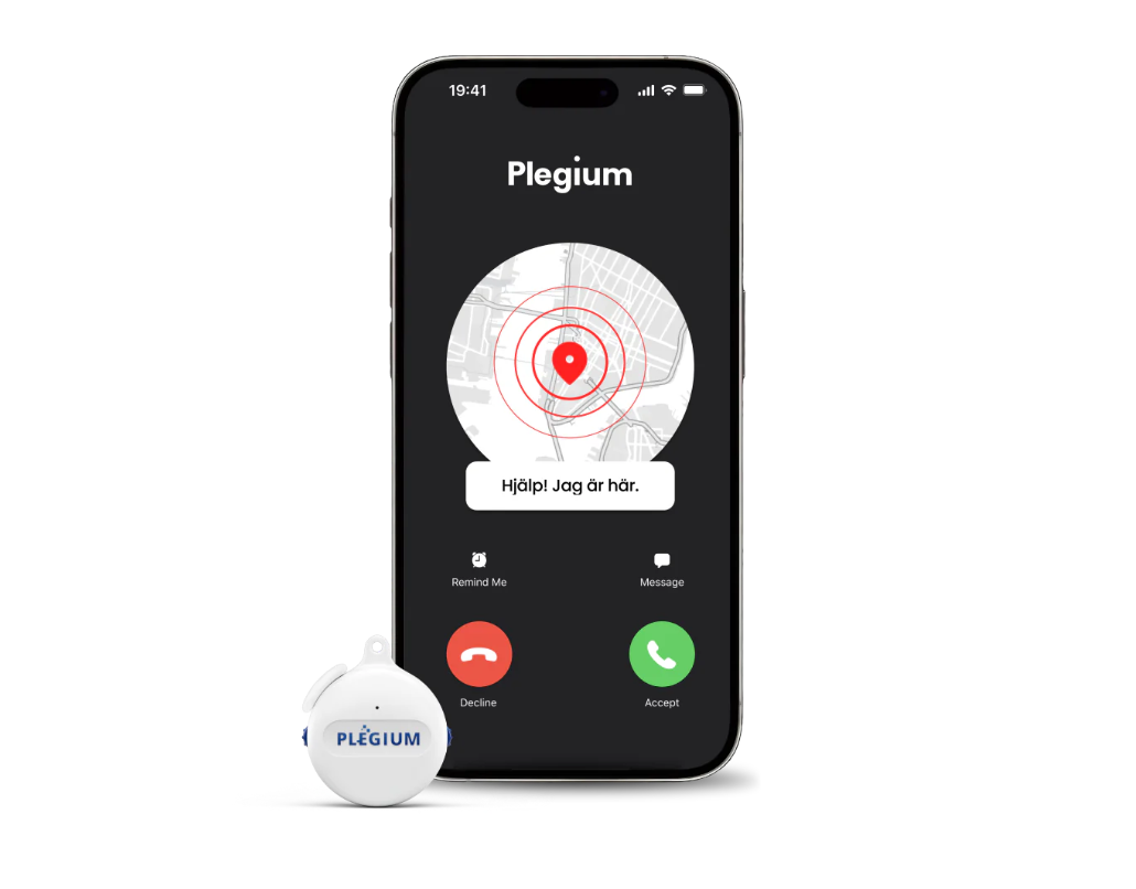 Pleagium Button Wearable in front of smartphone showing emergency call being placed